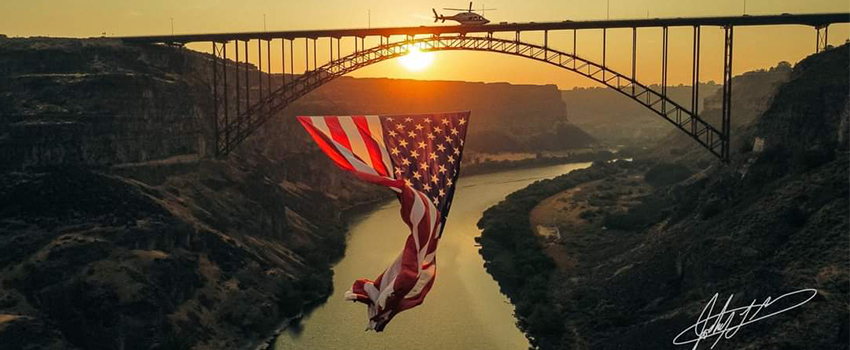 An American flag flies near Perrine Bridge in Twin Falls as Air St. Luke
